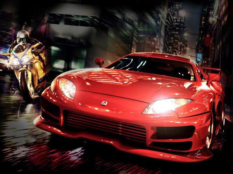 Red sports car racing at night