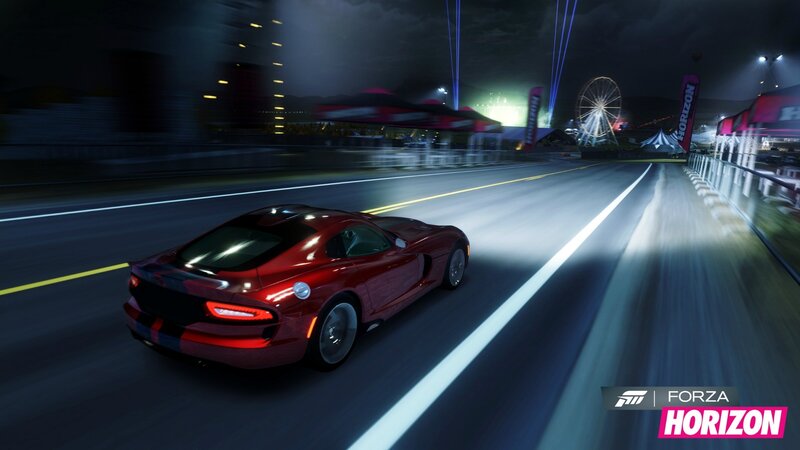Red sports car racing at night