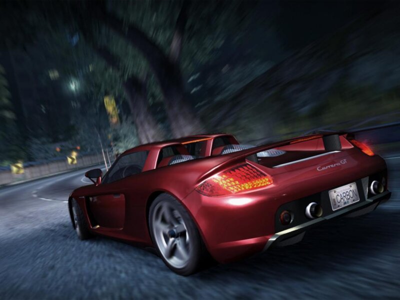 Red sports car racing at night