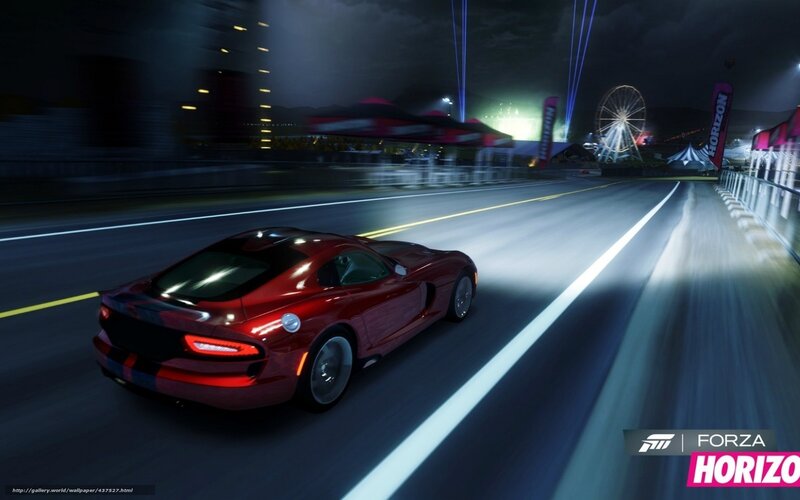 Red sports car racing at night