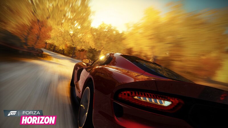 Red sports car racing at sunset