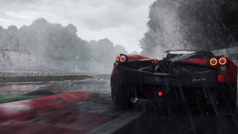 Red sports car racing in rain