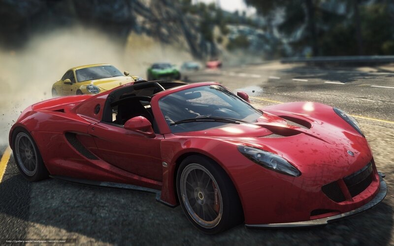 Red sports car racing on road