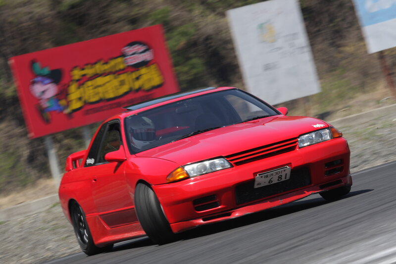 Red sports car racing on track