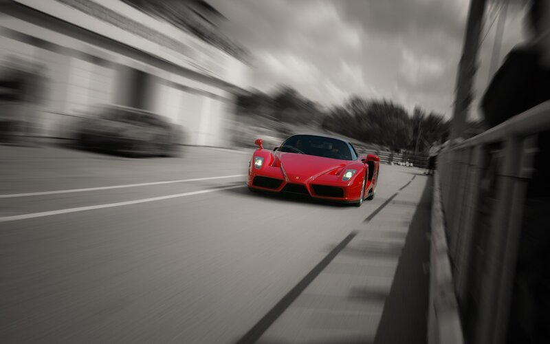 Red sports car racing on track