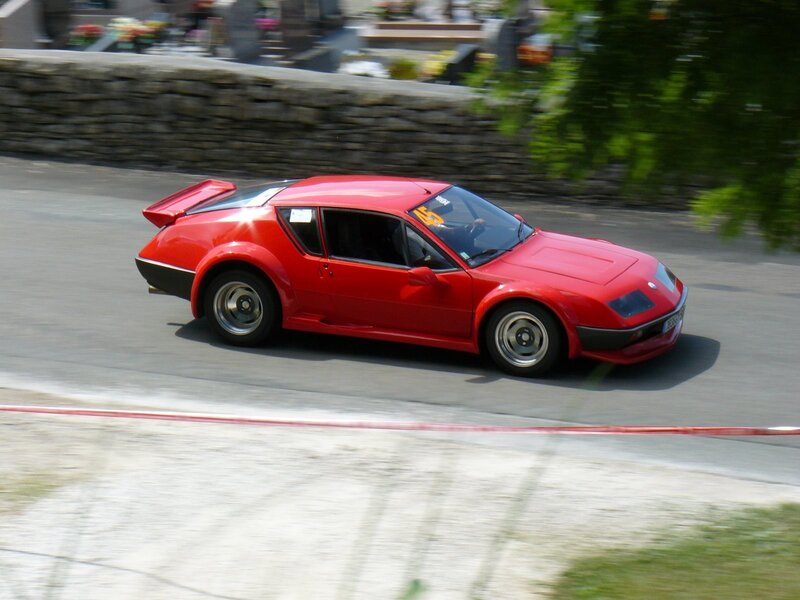 Red sports car racing on track