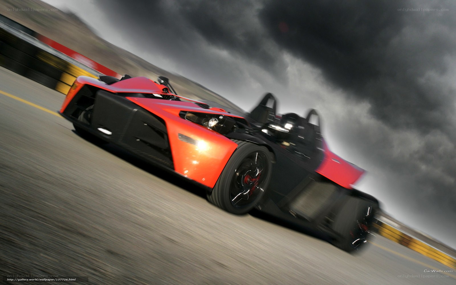 Red sports car racing on track