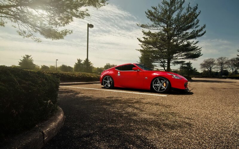 Red Sports Car — Serene, Afternoon, Photograph, Trees, Parking Lot, Hedge, Green, Gray