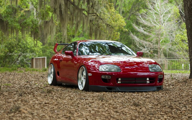 Red Sports Car — Serene, Afternoon, Photograph, Trees, Wood Chips