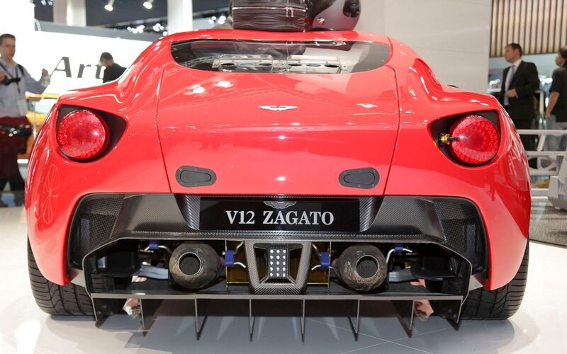 Red Sports Car — Showroom, Photograph, Exhaust Pipes