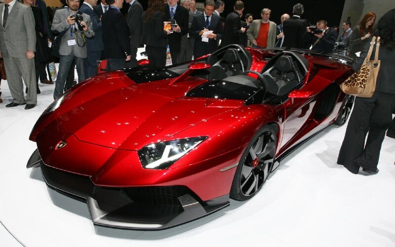 Red Sports Car — Showroom, Photograph, People, Camera