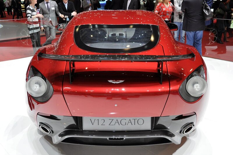 Red Sports Car — Showroom, Photograph, People, Exhibition