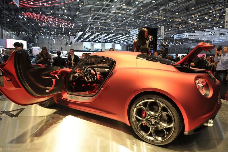 Red Sports Car — Showroom, Photograph, People
