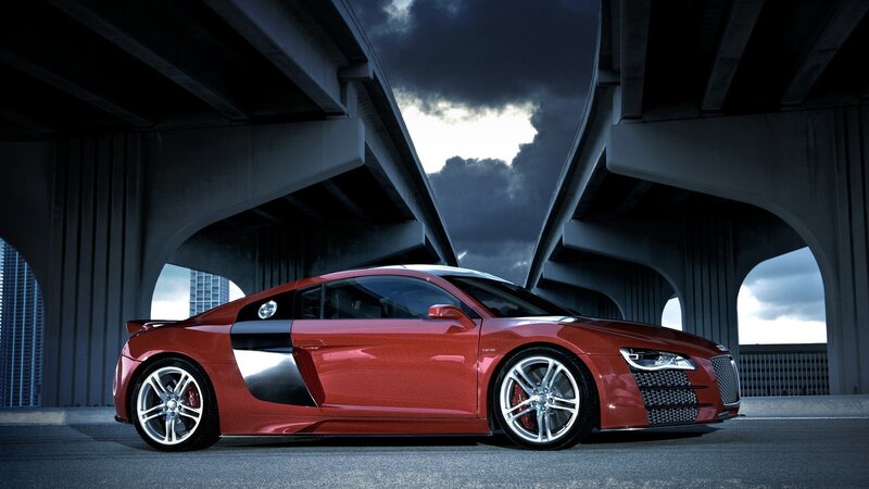 Red sports car under bridge