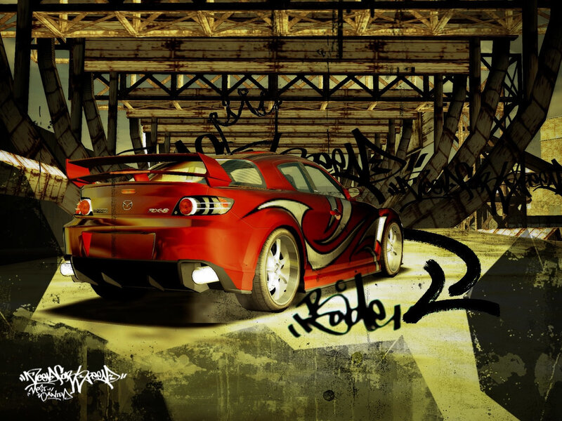 Red sports car under bridge