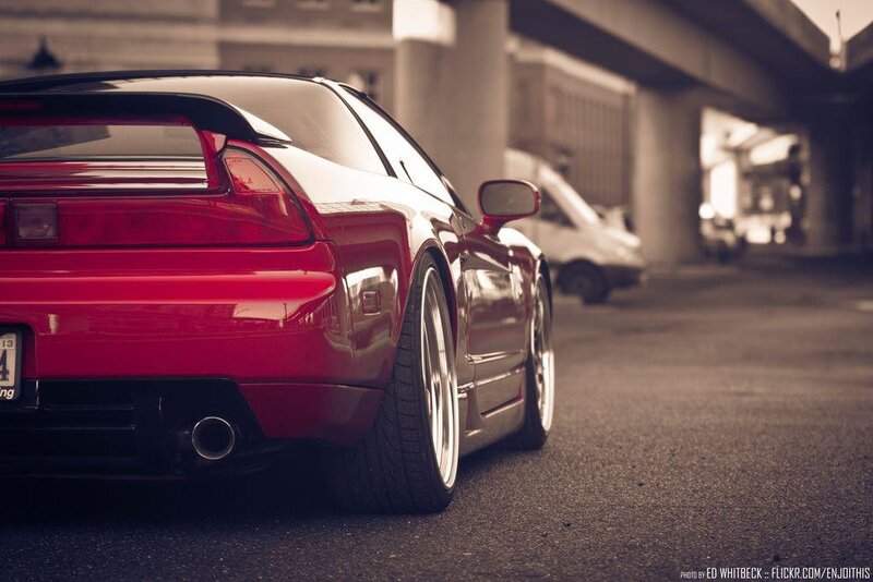red sports car under overpass