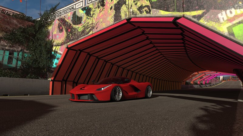 Red Sports Car under Tunnel