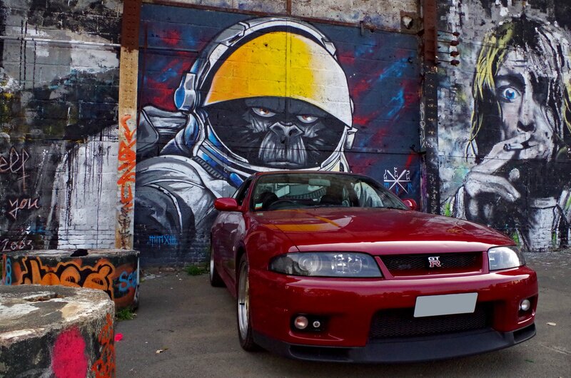Red Sports Car — Urban, Afternoon, Photograph, Graffiti Wall