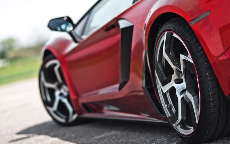 Red Sports Car Wheel — Dramatic, Photograph