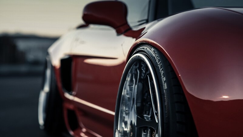 Red Sports Car Wheel — Dramatic, Sunset