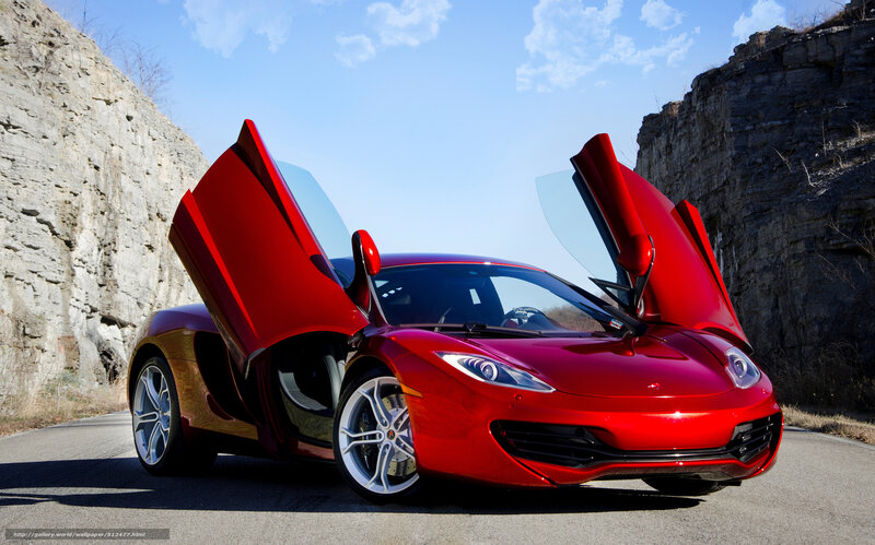 Red sports car with doors open