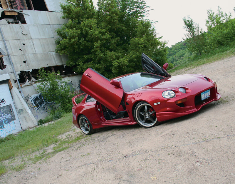 Red sports car with doors open