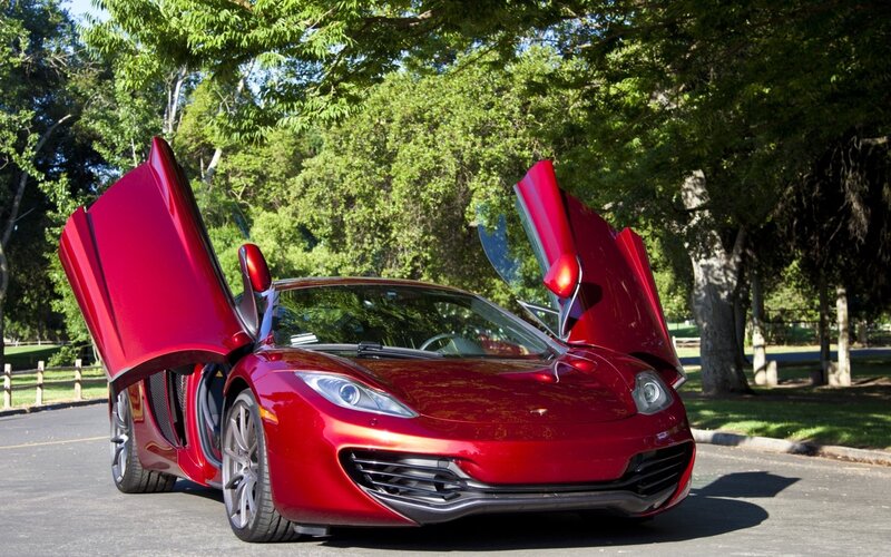 Red sports car with doors open