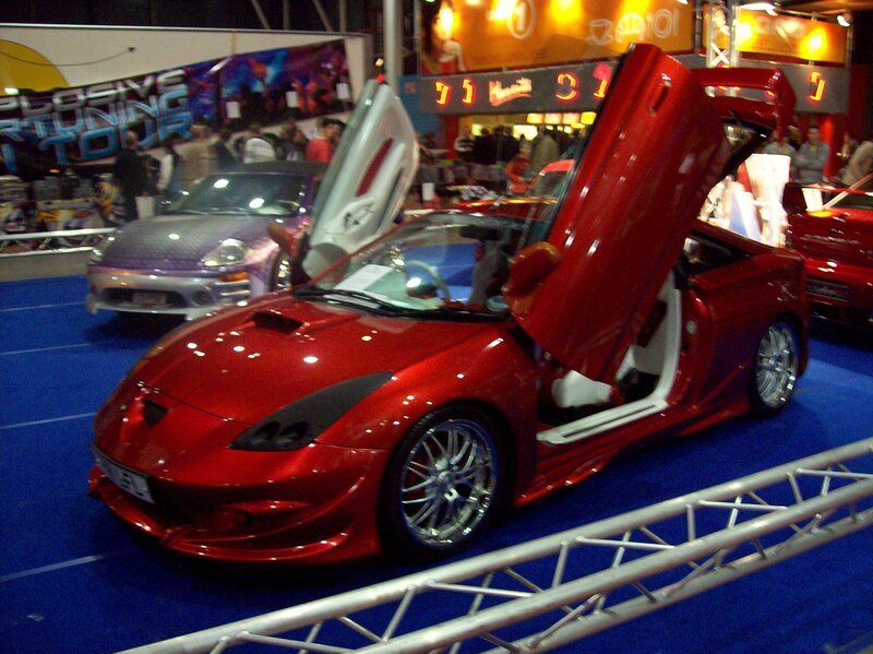 Red sports car with doors open