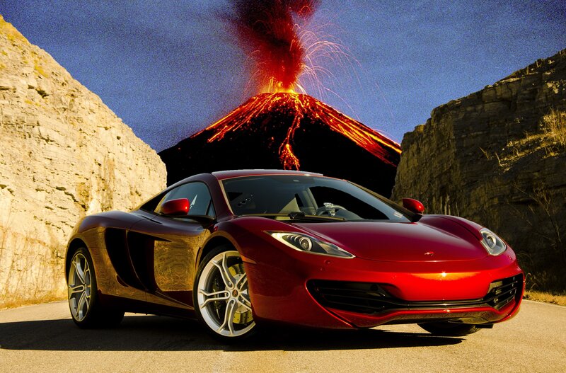 Red sports car with erupting volcano