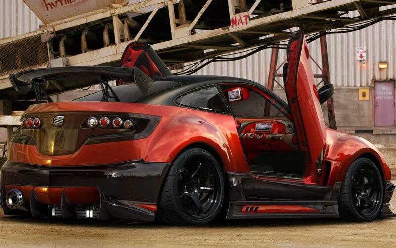 red sports car with gullwing doors