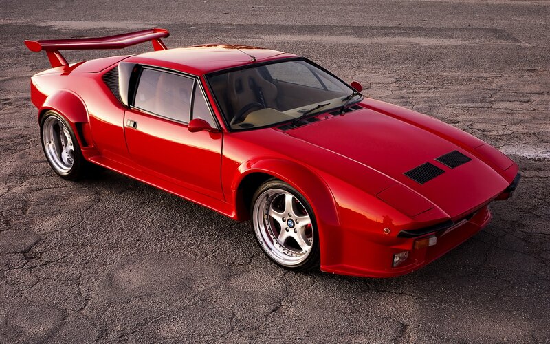 Red sports car with large rear wing