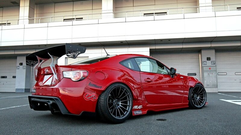 red sports car with large wing