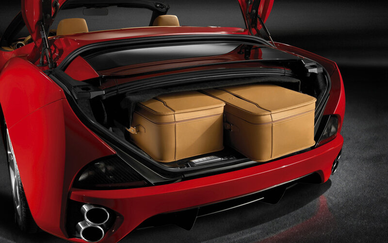 Red sports car with luggage