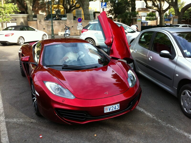 Red sports car with open door