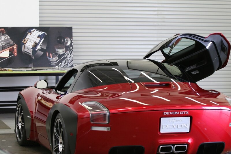 Red sports car with open door