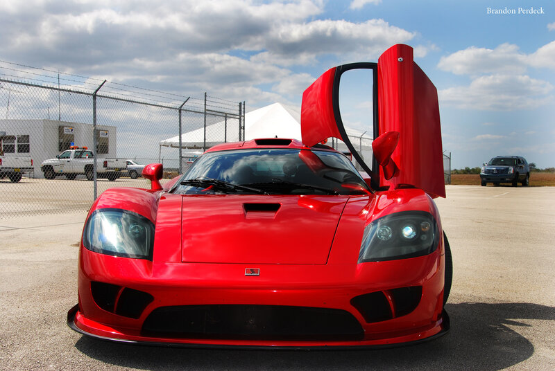 Red sports car with open doors