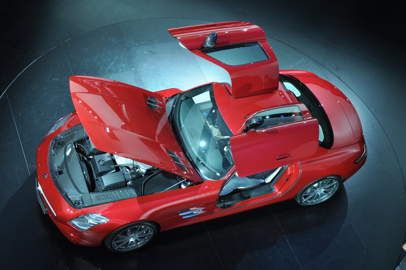 Red sports car with open doors