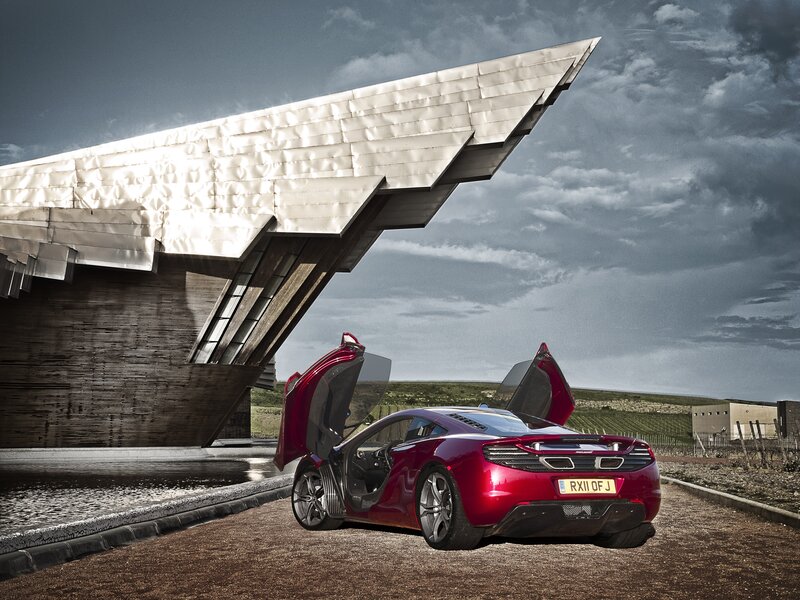 Red sports car with open doors