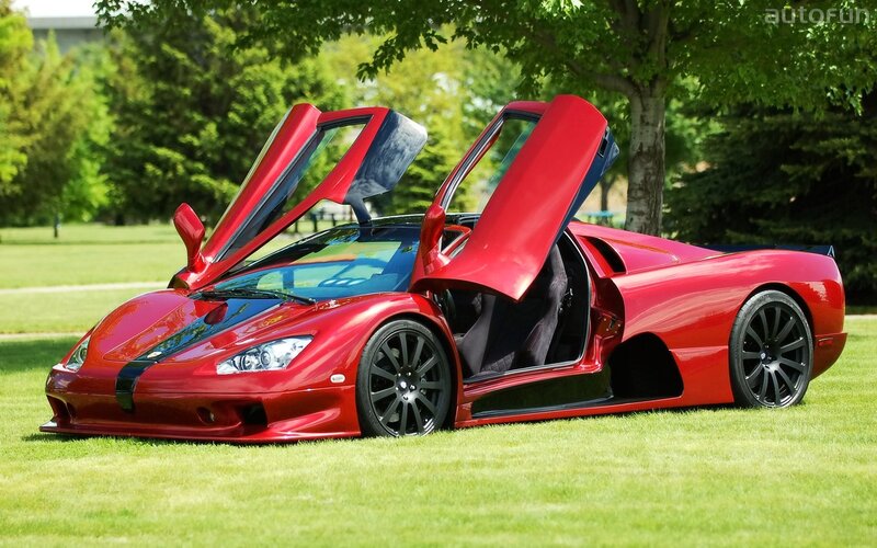 Red sports car with open doors