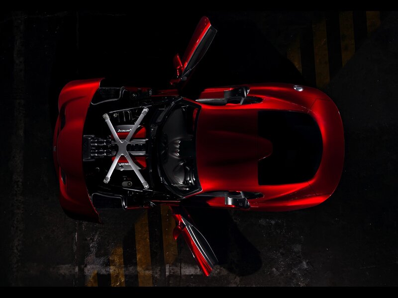 Red sports car with open doors
