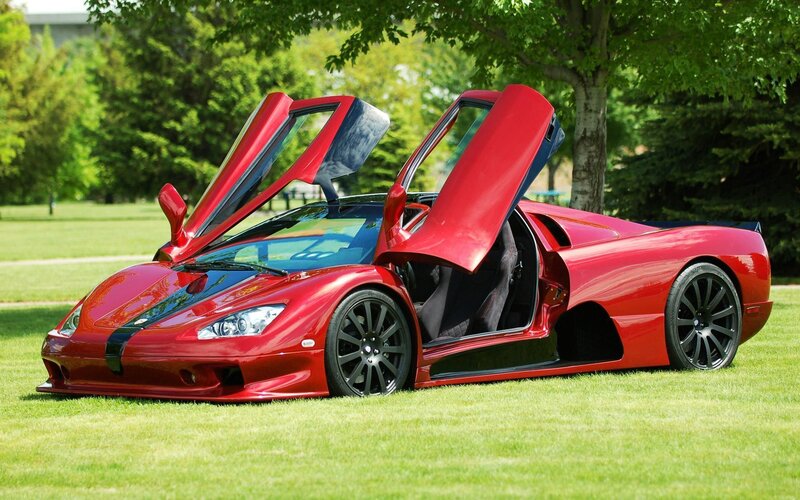 Red sports car with open doors