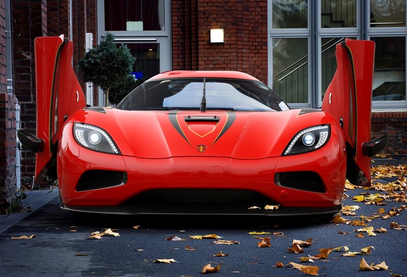 Red sports car with open doors