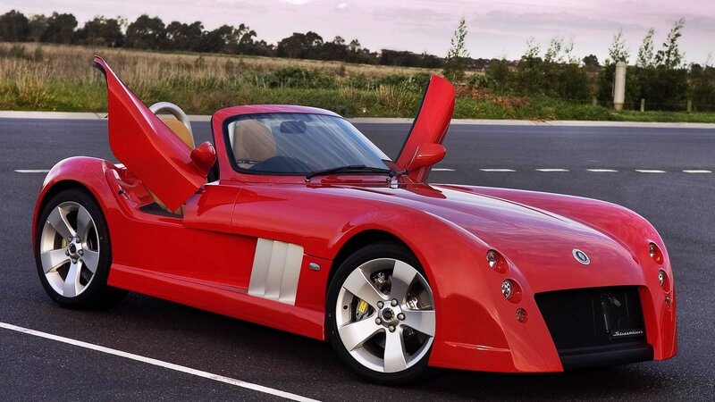 Red sports car with open doors