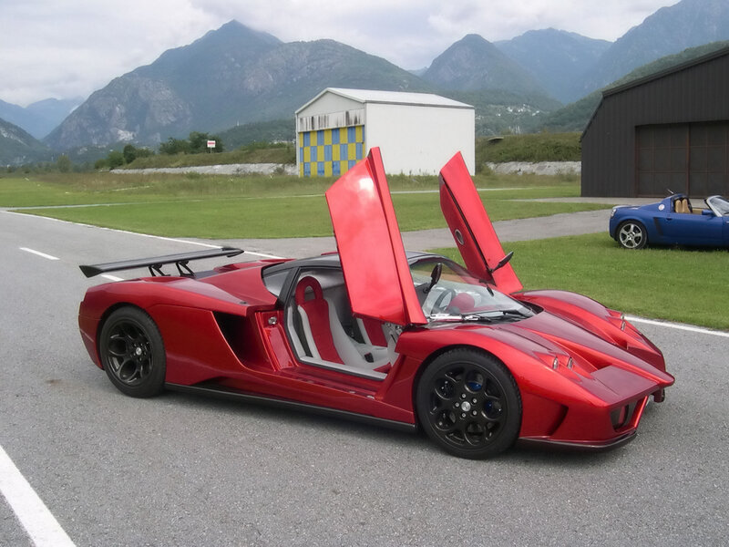 Red sports car with open doors