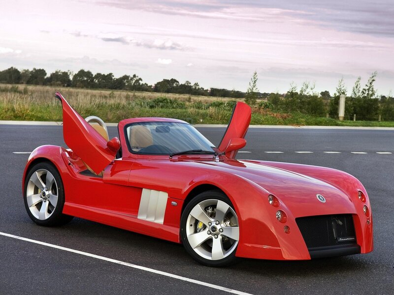 Red sports car with open doors