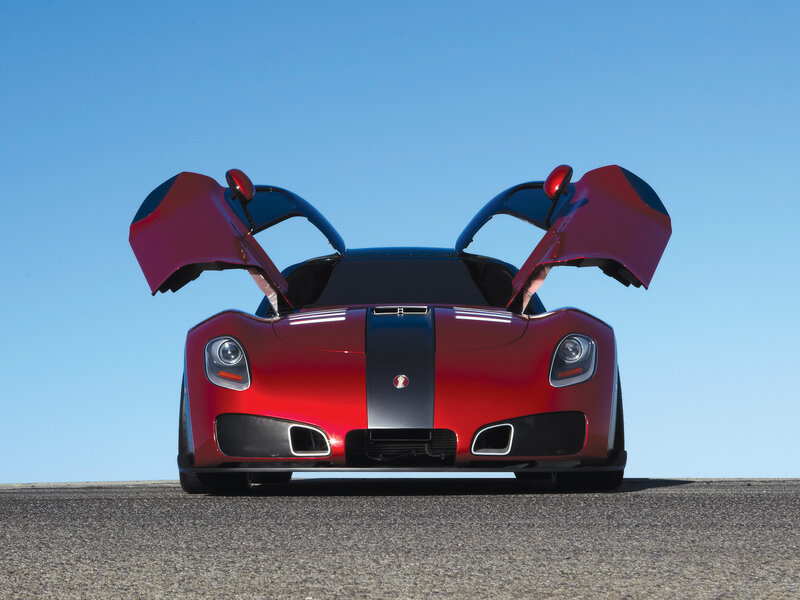 Red sports car with open doors