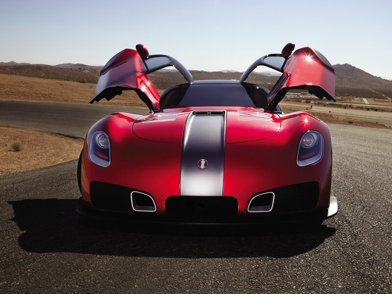 Red sports car with open doors