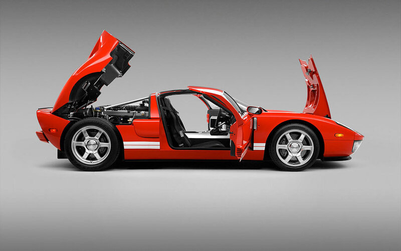Red sports car with open doors