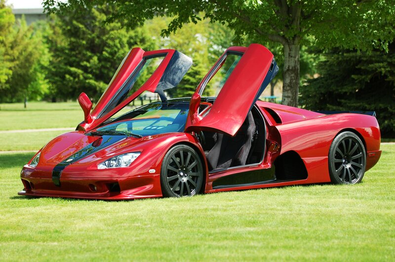 Red sports car with open doors