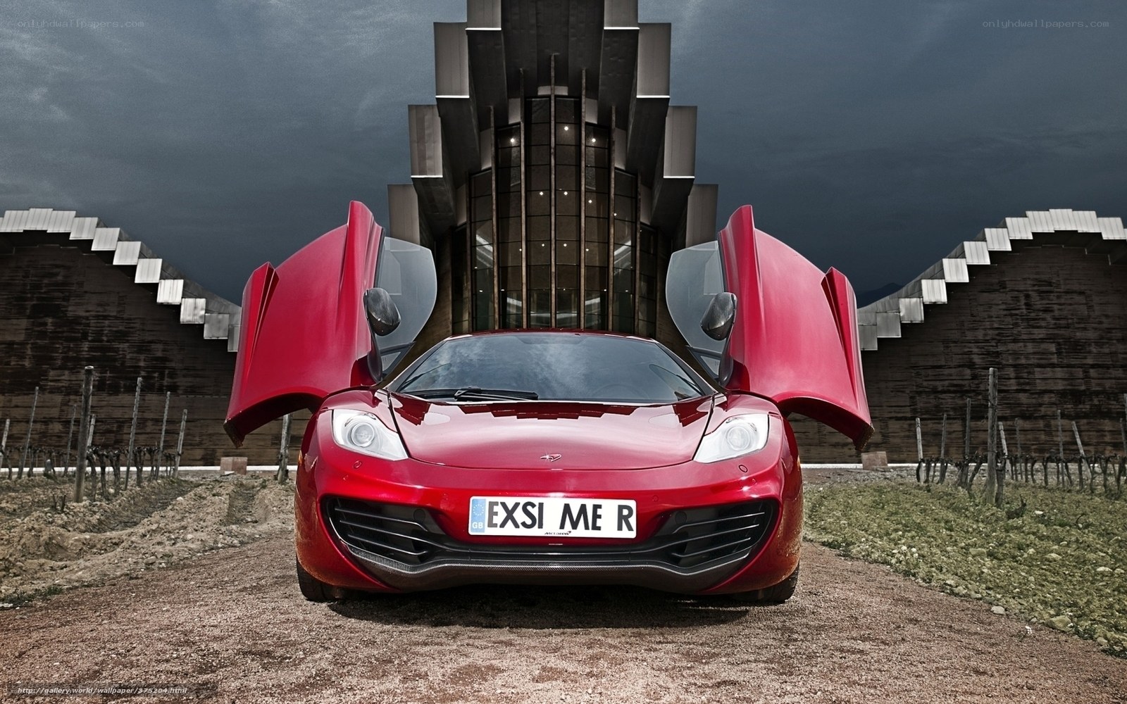 Red sports car with open doors